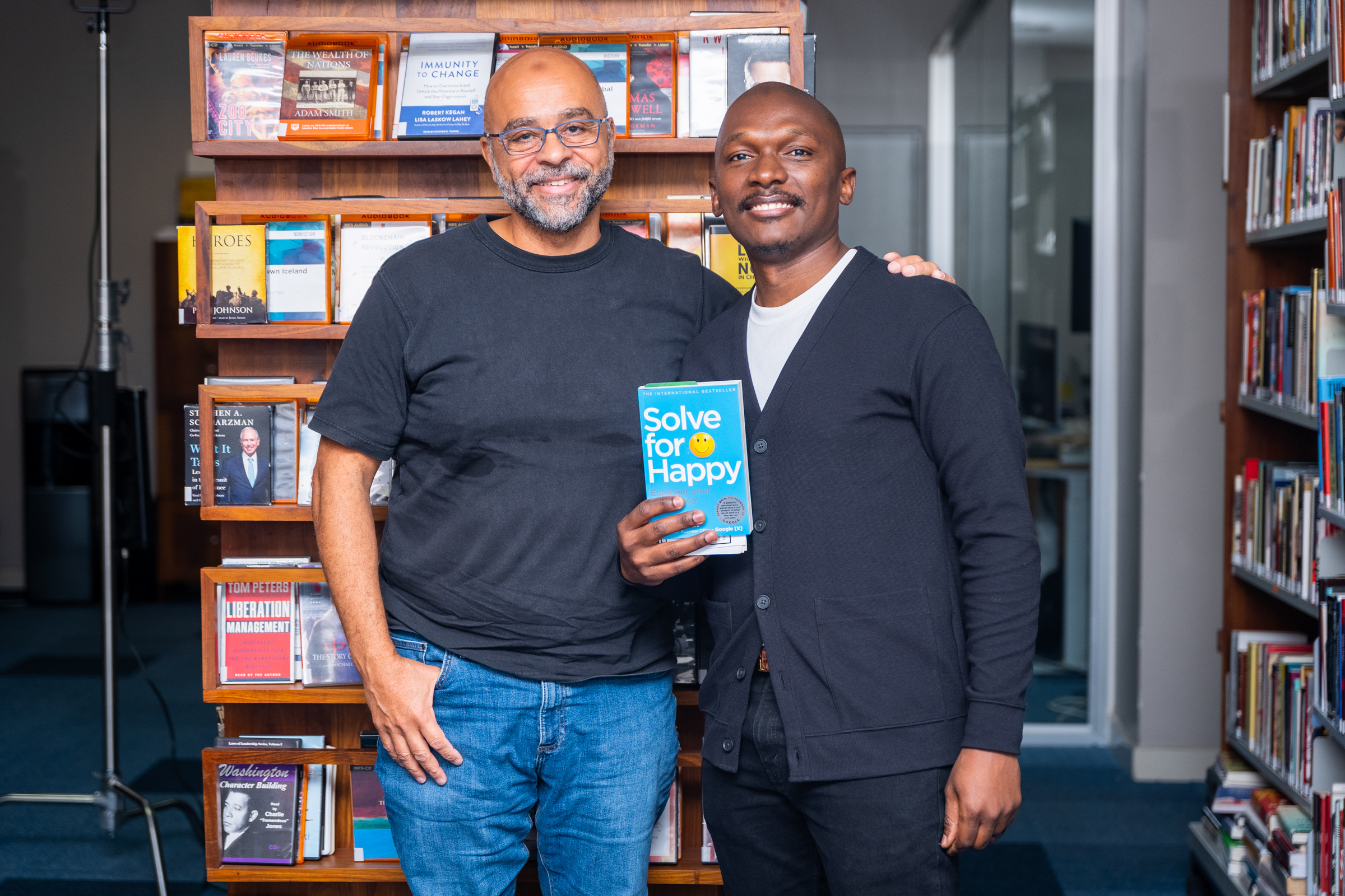 Ben Owden with Mo Gawdat, holding Solve for Happy — Why Lead? Podcast