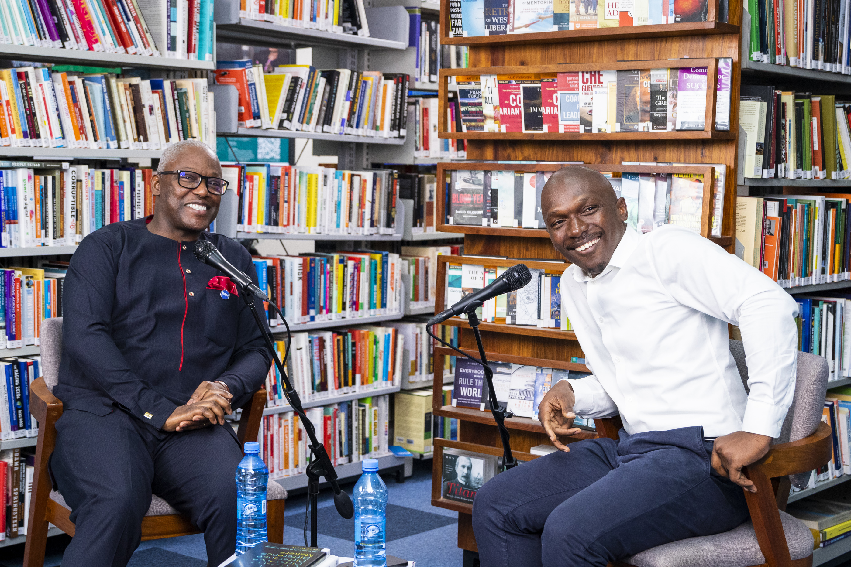 Ben Owden smiling with a guest during a recorded conversation